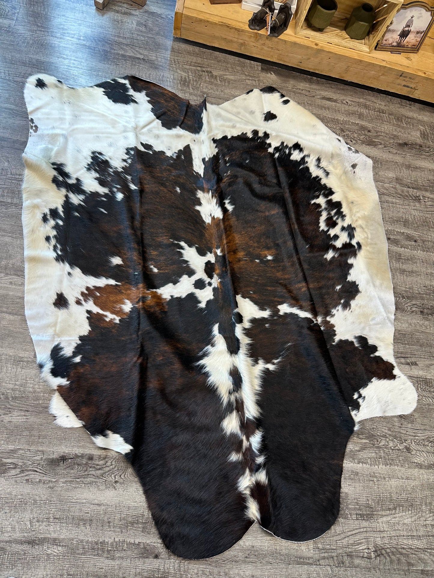 Brindle Tricolor White Backbone Cowhide Rug