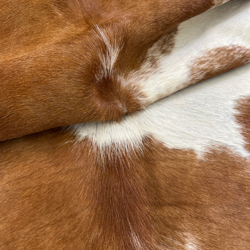 Brown and White Cowhide Rug